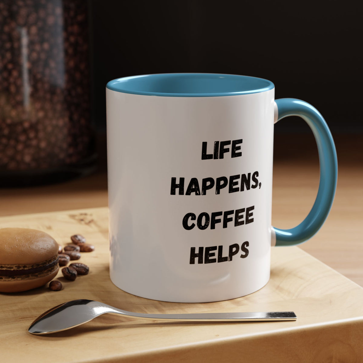 Black ceramic mug with "Life Happens Coffee Helps" text, 11oz or 15oz capacity, featuring a black handle and rim, printed by Printify.
