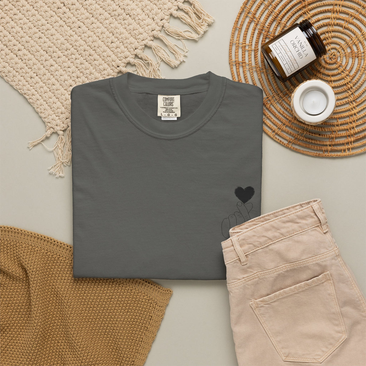 Black T-shirt by Printify featuring a minimal finger heart graphic design on the front.