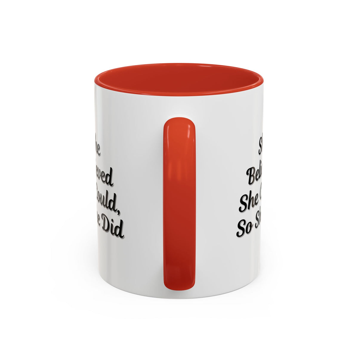White ceramic motivational coffee mug with black text that reads "She Believed She Could, So She Did" featuring a simple design.
