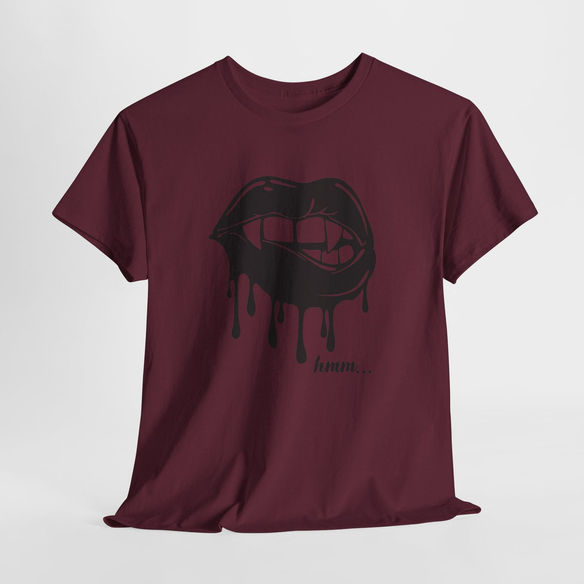 Graphic T-shirt featuring dripping lips and "hmm..." bite design in black and white, by Printify, shown on a white background.