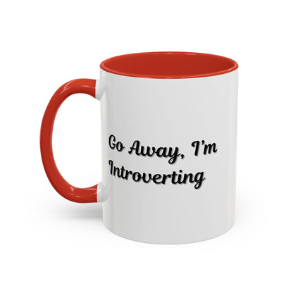 Ceramic coffee mug with "Go Away, I'm Introverting" text, 11 oz size, featuring a white background and black lettering.