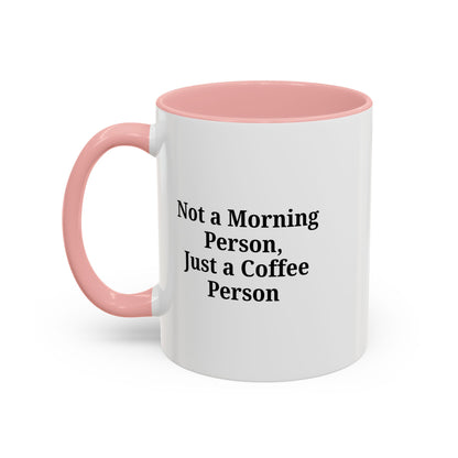 White ceramic coffee mug with "Not a Morning Person, Just a Coffee Person" text, perfect for morning coffee lovers.