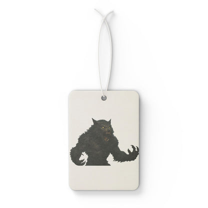 Werewolf car air freshener accessory by Printify, featuring a spooky Halloween design, hanging from a car rearview mirror.