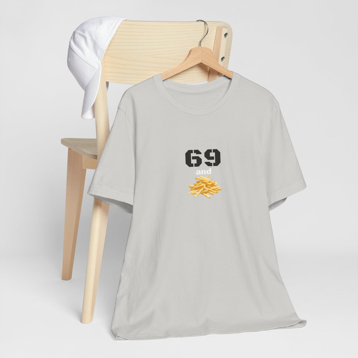 Unisex graphic T-shirt with funny 69 and French fries print, featuring quirky design on comfortable fabric.
