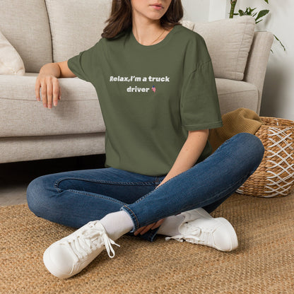 Pink heart graphic on white Relax, I'm a Truck Driver T-Shirt by Printify, featuring a humorous trucker slogan in casual style.
