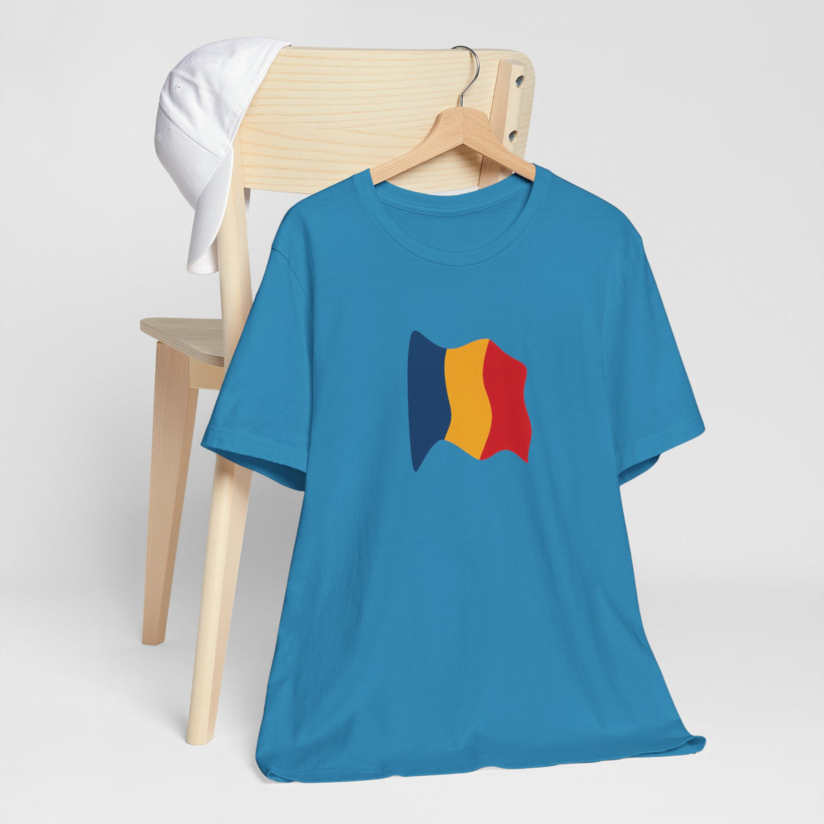 Romania flag T-shirt featuring a minimal waving tricolor design, casual unisex tee by Printify, white fabric with Romanian flag pattern.