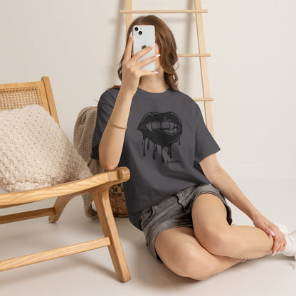 Black graphic T-shirt featuring dripping lips and 'hmm...' bite design by Printify, with a bold, artistic look.