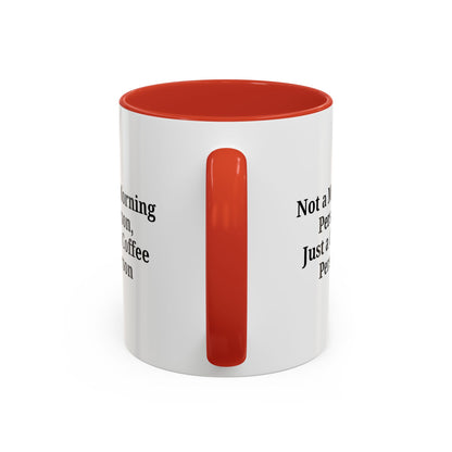 Ceramic coffee mug with "Not a Morning Person, Just a Coffee Person" text, featuring a white background and colorful lettering.