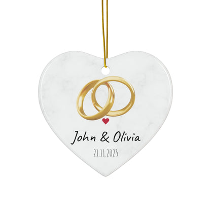 Round ceramic wedding rings ornament with personalized names and date, decorative keepsake for wedding memories.