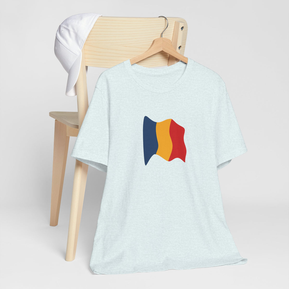 Romania flag T-shirt by Printify featuring a minimal waving tricolor design on a casual cotton tee.