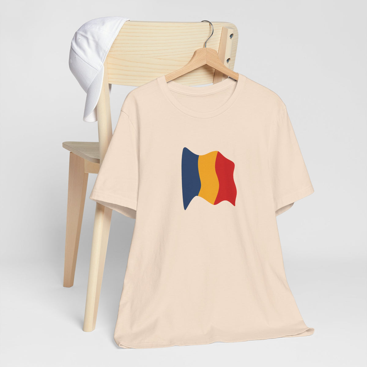 Romania flag T-shirt by Printify featuring a minimal waving tricolor design on a casual tee.