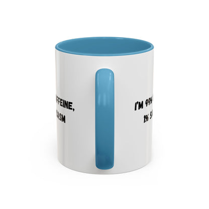 Ceramic coffee mug with "I'm 99% Caffeine, 1% Sarcasm" print, featuring a white background and black text.