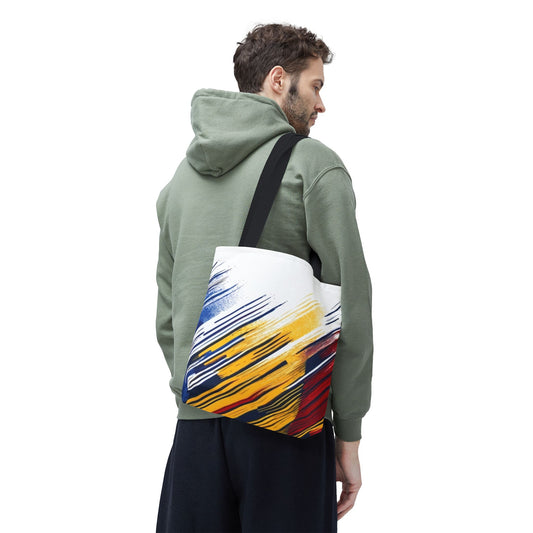 Abstract brushstroke tote bag in bold red, yellow, and blue print by Printify, featuring a spacious design and vibrant all-over pattern.