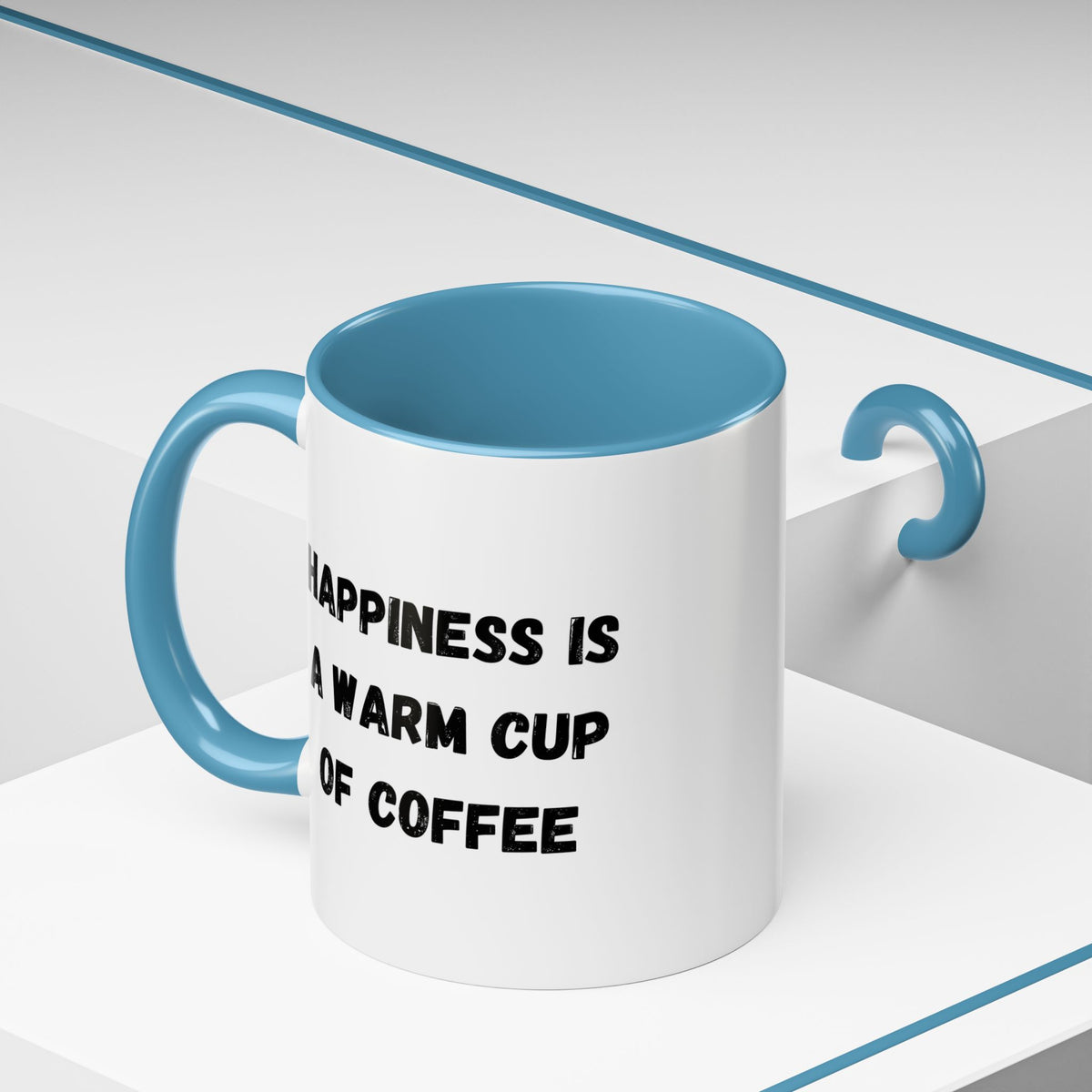 Ceramic coffee mug with the quote “Happiness Is A Warm Cup Of Coffee” in black text on white background.