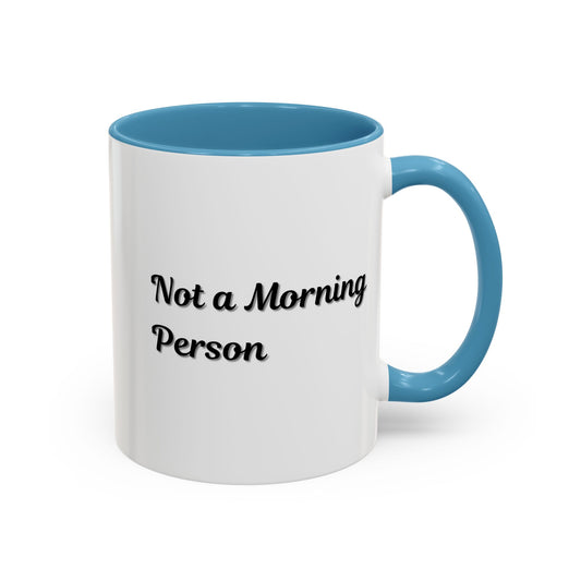 Ceramic "Not a Morning Person" coffee mug with 11oz or 15oz capacity, featuring bold text and a white handle.