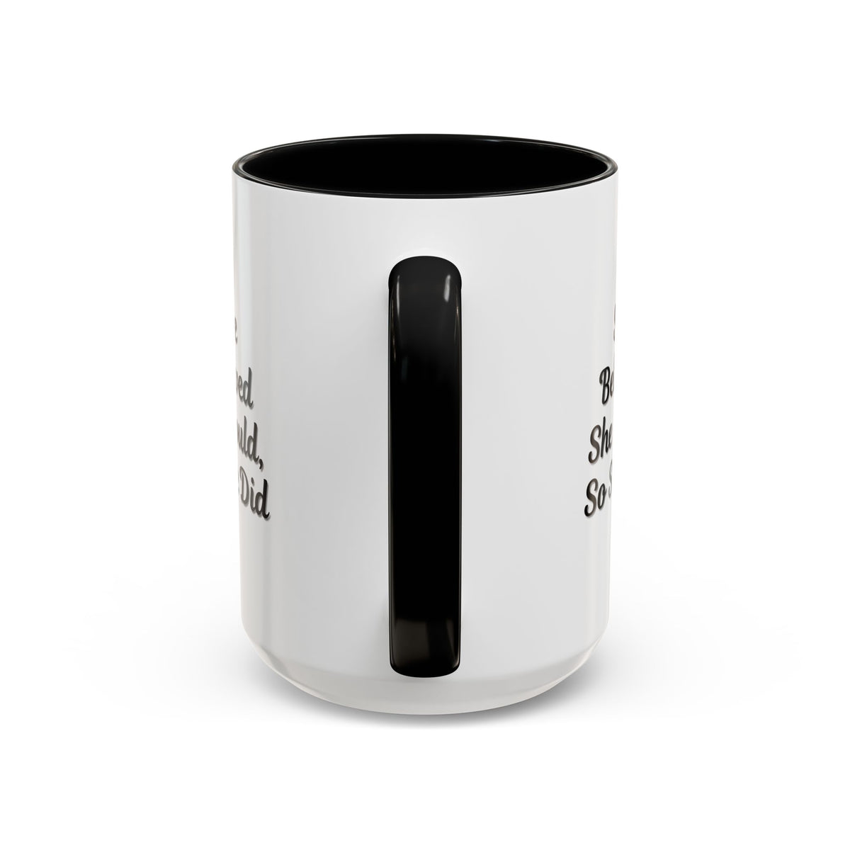 Ceramic motivational coffee mug with "She Believed She Could, So She Did" quote, featuring a white background and black text.
