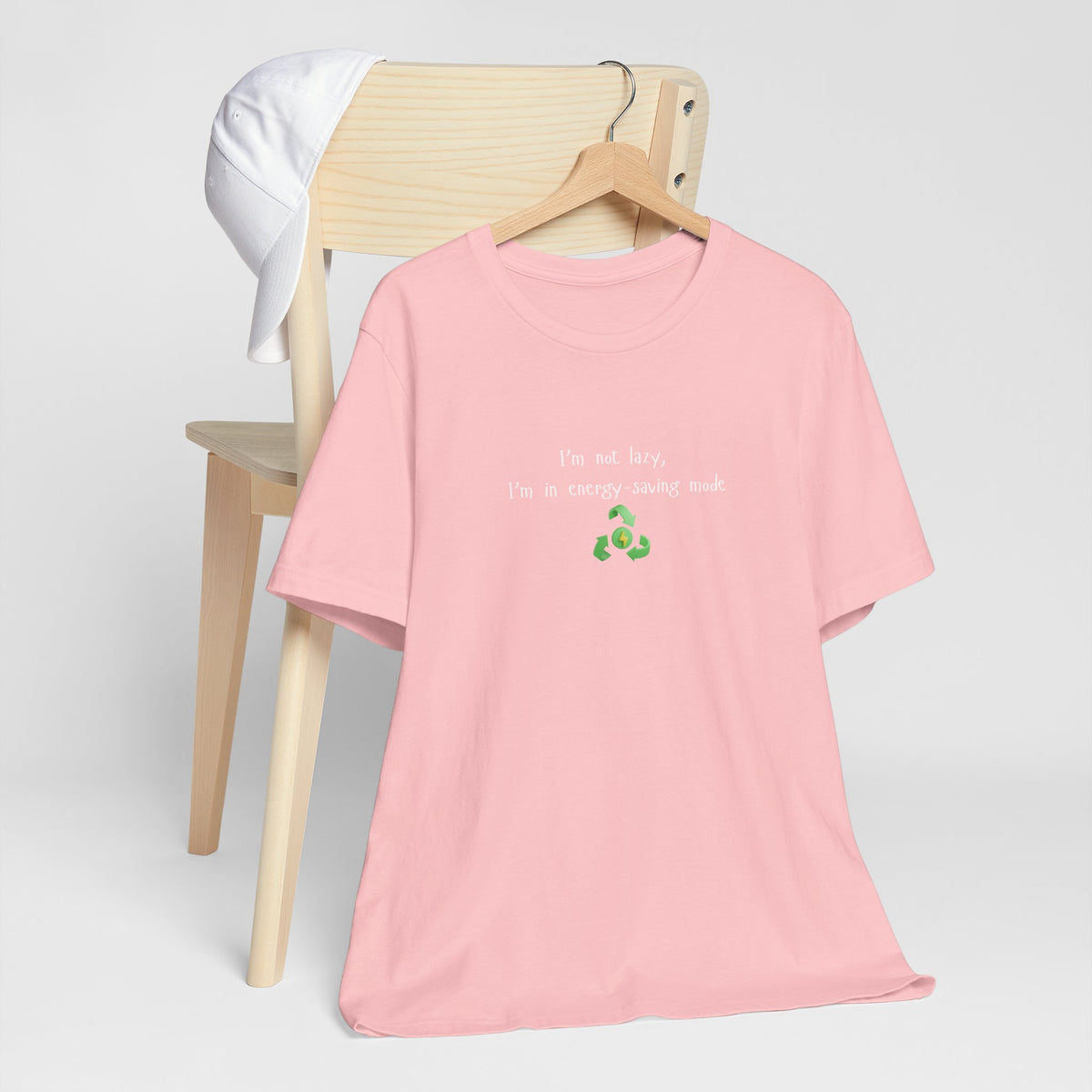 Eco-friendly mock T-shirt with humorous "I’m Not Lazy, I’m an Energy-Saving" print, made by Printify.