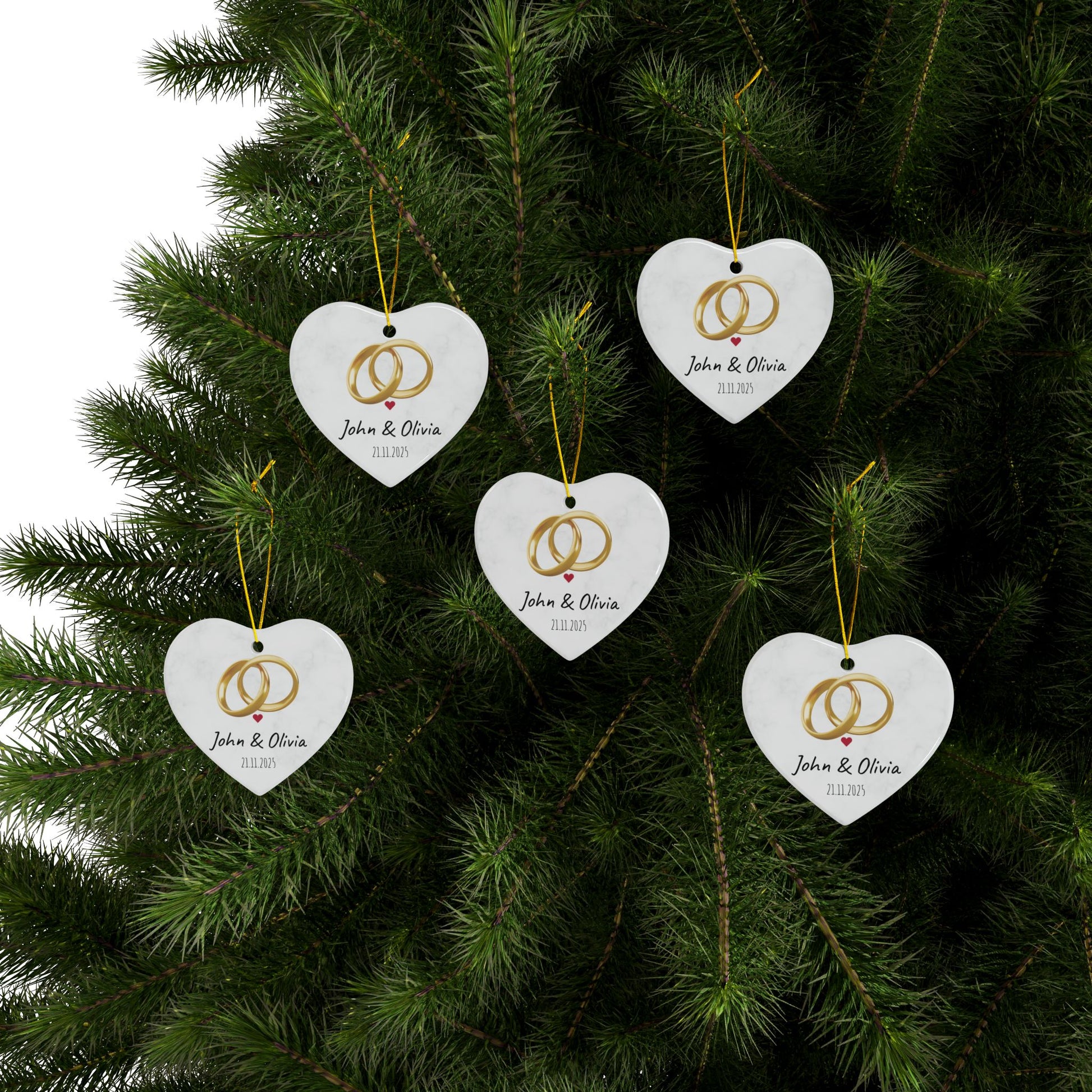 Round ceramic wedding rings ornament with personalized names and date, featuring a decorative design for special occasions.