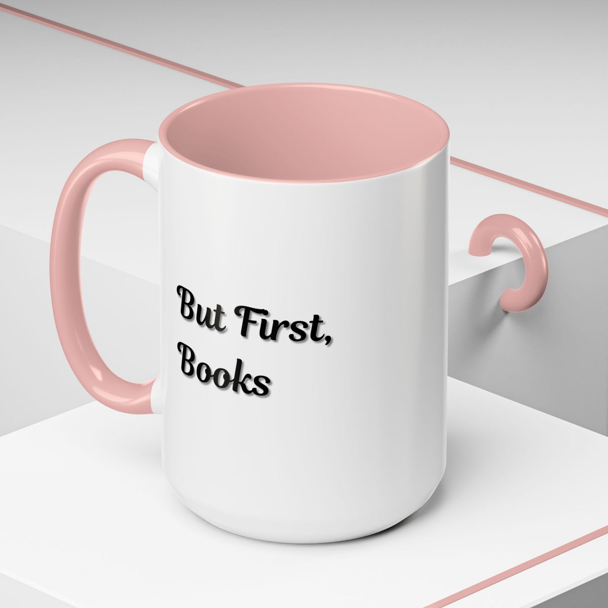 Ceramic coffee mug with "But First, Books" quote, ideal for book lovers, featuring a stylish design on a white background.