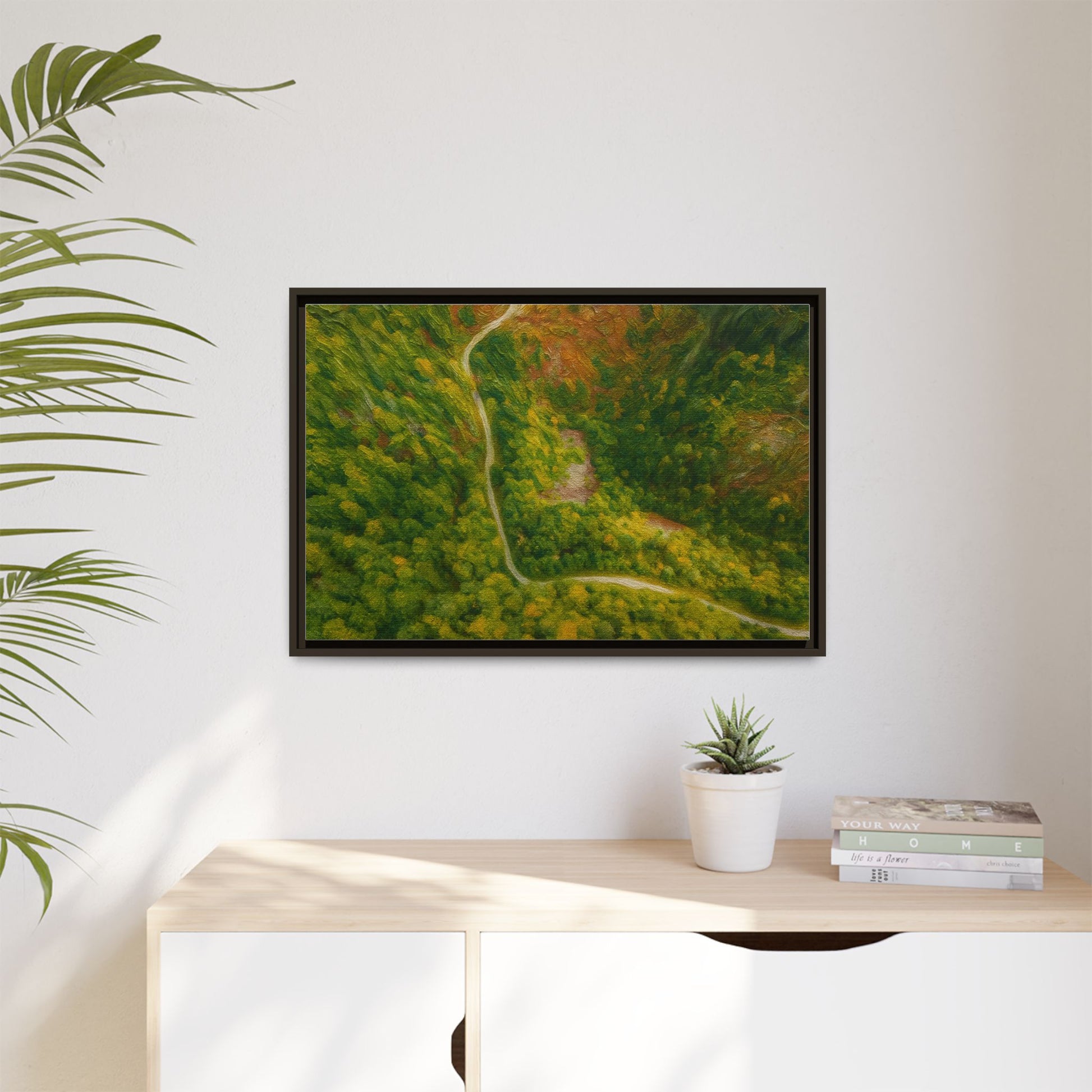 Colorful framed matte canvas wall art featuring an aerial view of a forest path landscape by Printify