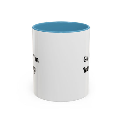 Ceramic coffee mug with "Go Away, I'm Introverting" quote, 11 oz size, featuring a white background and black text design.