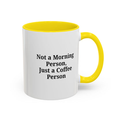 Ceramic coffee mug with "Not a Morning Person, Just a Coffee Person" text, perfect for morning beverage lovers.