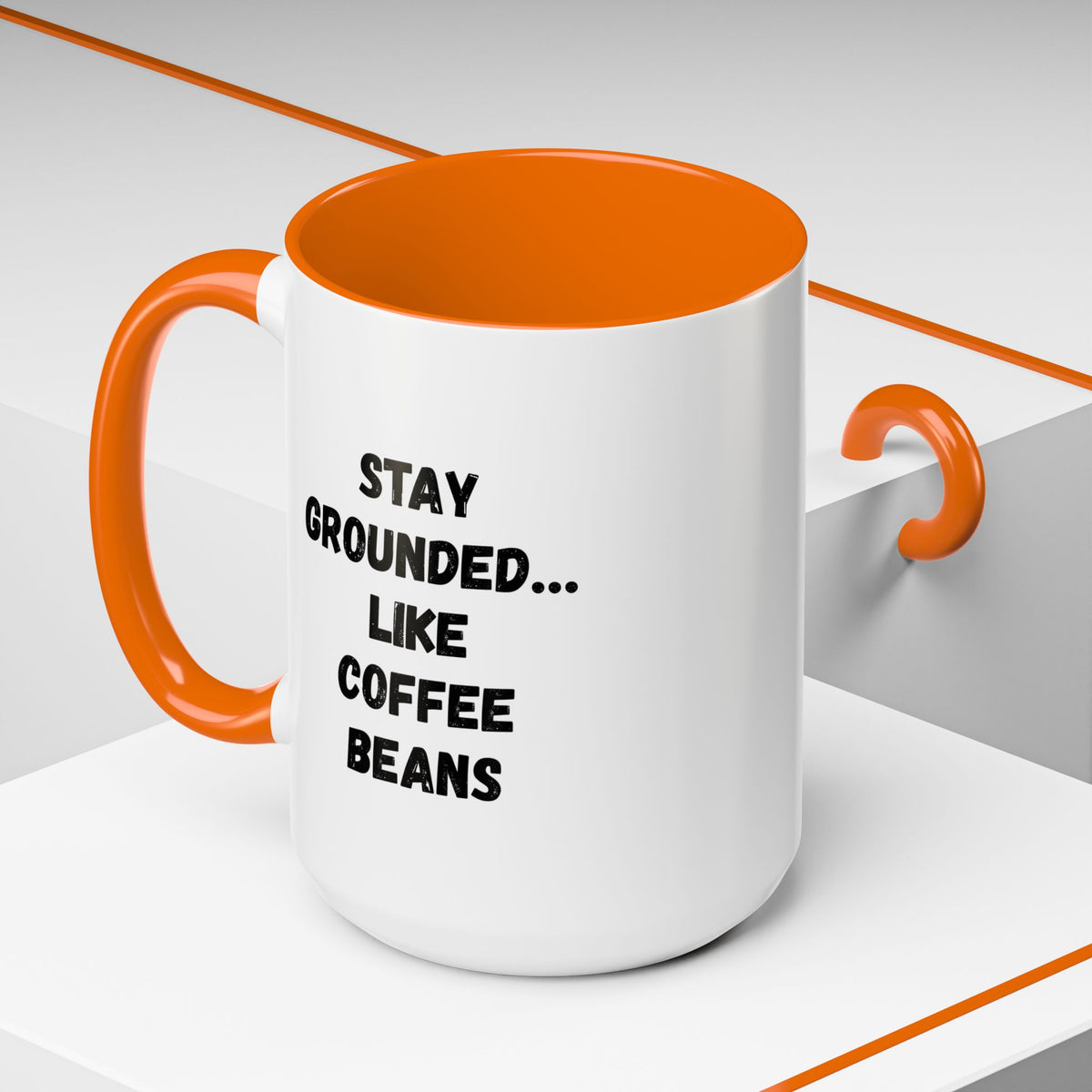 White ceramic mug with "Stay Grounded Like Coffee Beans" printed text, ideal for coffee lovers, 11oz size.