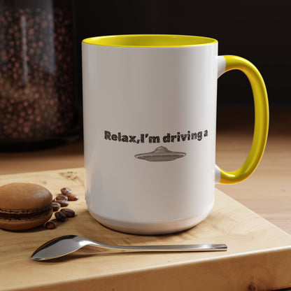 Ceramic coffee mug with UFO accent and "Relax, I’m Driving" text in 11 oz size, designed by Printify.
