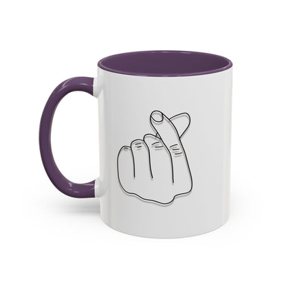 White ceramic coffee mug with minimal Korean finger heart accent design, available in 11oz and 15oz sizes.