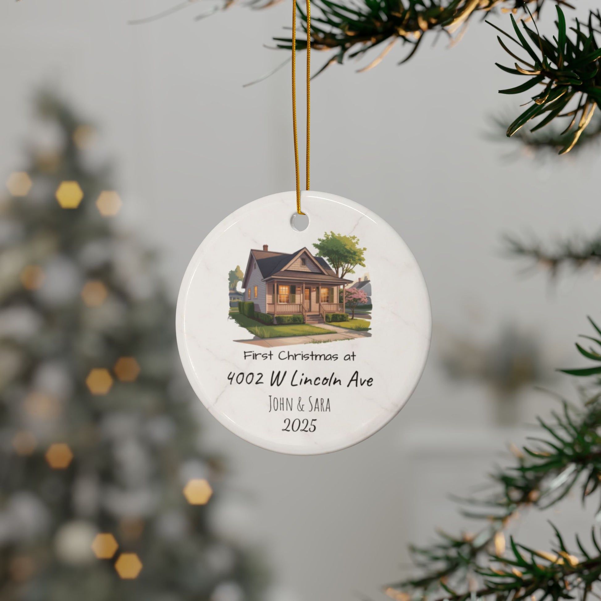 Personalized ceramic Christmas ornament with custom house illustration, address, and names on both sides, by Printify.