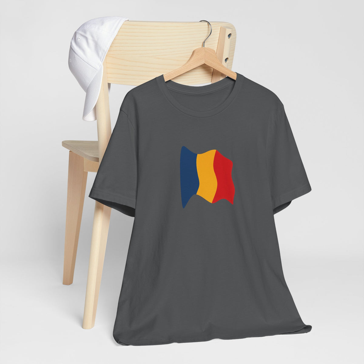 Romania flag T-shirt with a minimal waving tricolor design, made by Printify, featuring the Romanian national colors on soft fabric.