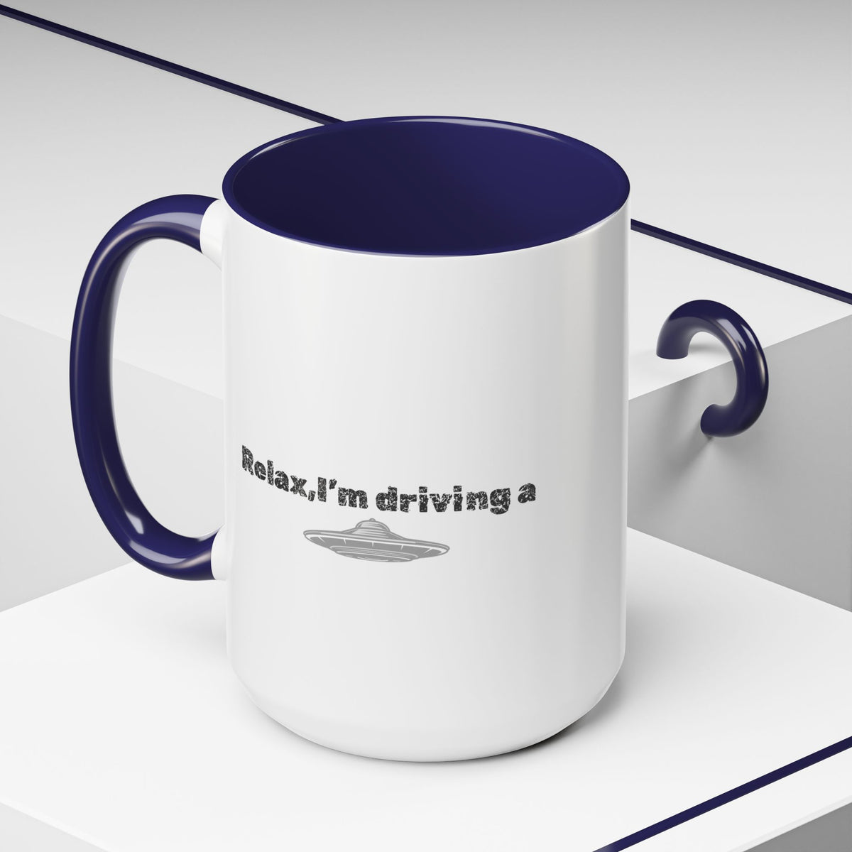 Ceramic coffee mug with "Relax, I’m Driving" UFO accent design, available in 11 or 15 oz sizes, by Printify.