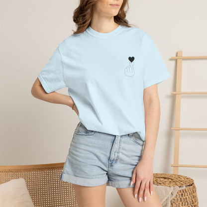 Black T-shirt with a minimal white finger heart graphic, featuring the Finger Heart T-Shirt by Printify.