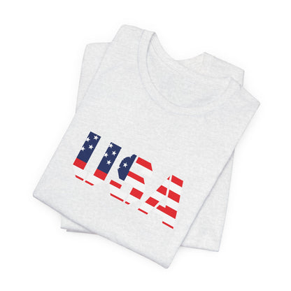 USA flag text T-shirt by Printify featuring patriotic design, perfect for Fourth of July celebrations, casual wear, and American pride.