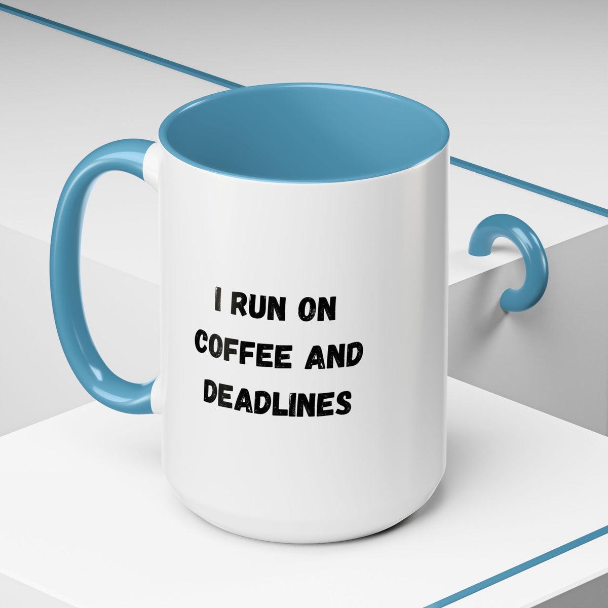 White ceramic coffee mug with black text reading "I run on coffee and deadlines" from Printify, shown with a close-up view.