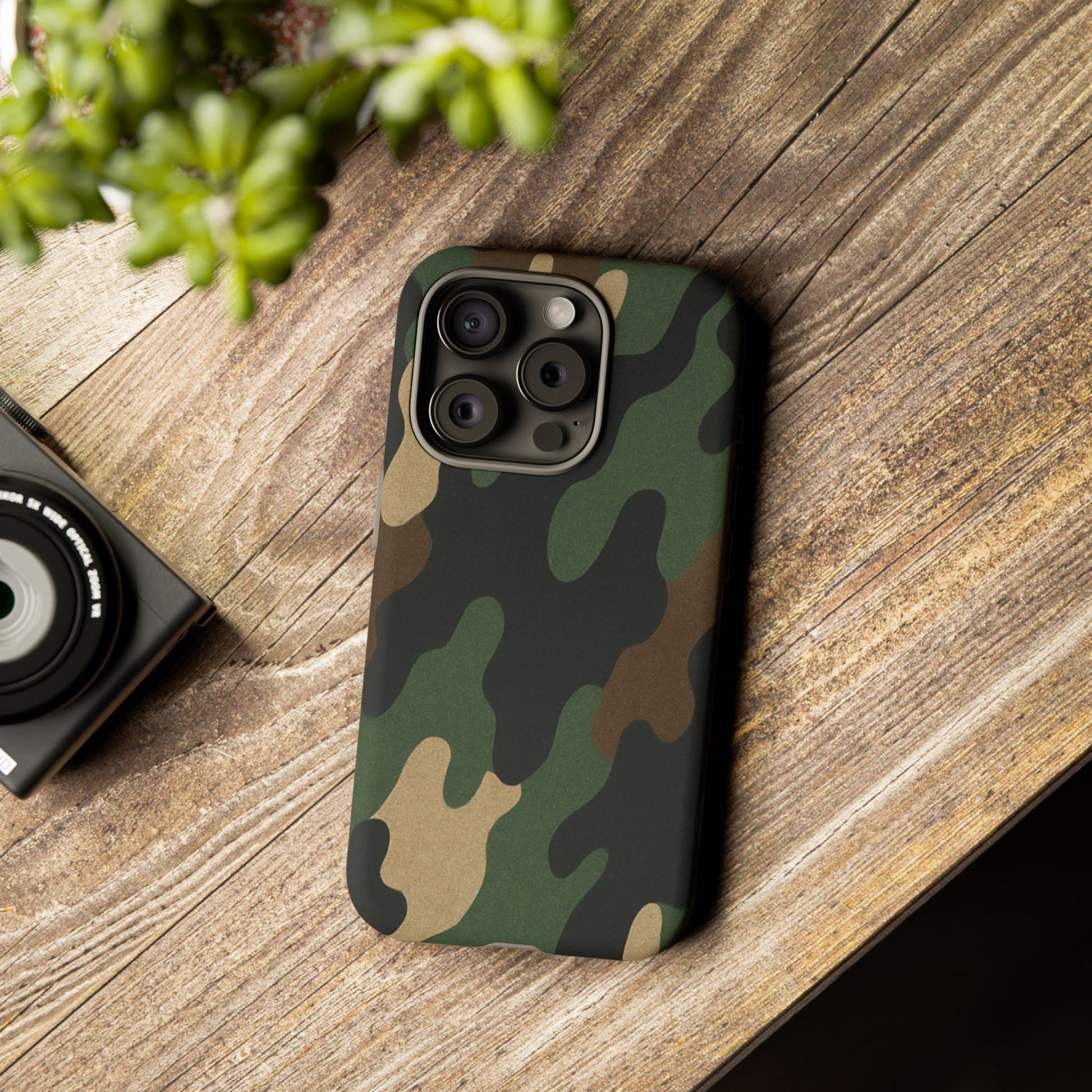 Rugged military green camo Printify Tough Phone Case protecting an iPhone with a durable, military-inspired design.