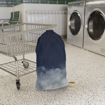 Drawstring canvas laundry bag with night sky clouds print by Printify, featuring a spacious design and sturdy drawstring closure.