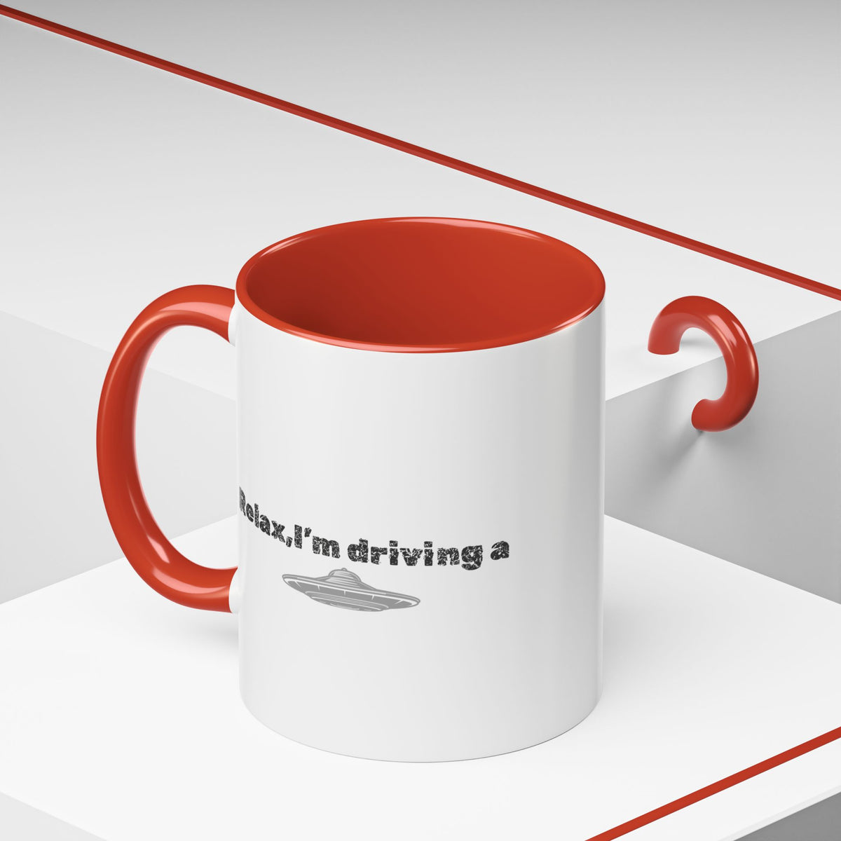 Ceramic coffee mug with "Relax, I’m Driving" UFO accent design in 11 oz size by Printify, showing the printed front view.