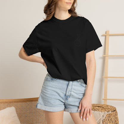 Black T-shirt with a minimal white finger heart graphic, featuring a simple heart design on the front.