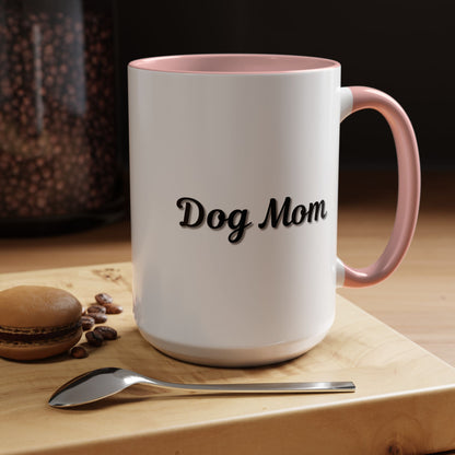Dog Mom Accent Coffee Mug — white ceramic coffee mug with retro script "Dog Mom" print, colored interior and C-handle, 11oz/15oz, angled view on wooden table
