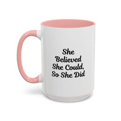 Ceramic motivational coffee mug with the quote "She Believed She Could, So She Did" in black text on a white mug.