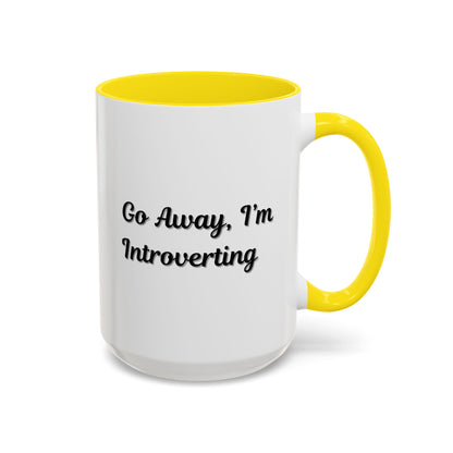 Ceramic coffee mug with "Go Away, I'm Introverting" quote, 11 oz, in white with black lettering, by Printify.