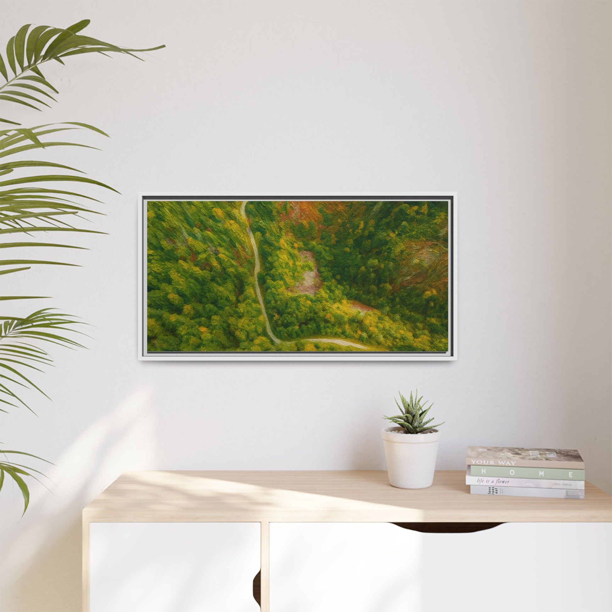 Colorful framed matte canvas wall art featuring an aerial view of a forest path landscape by Printify.