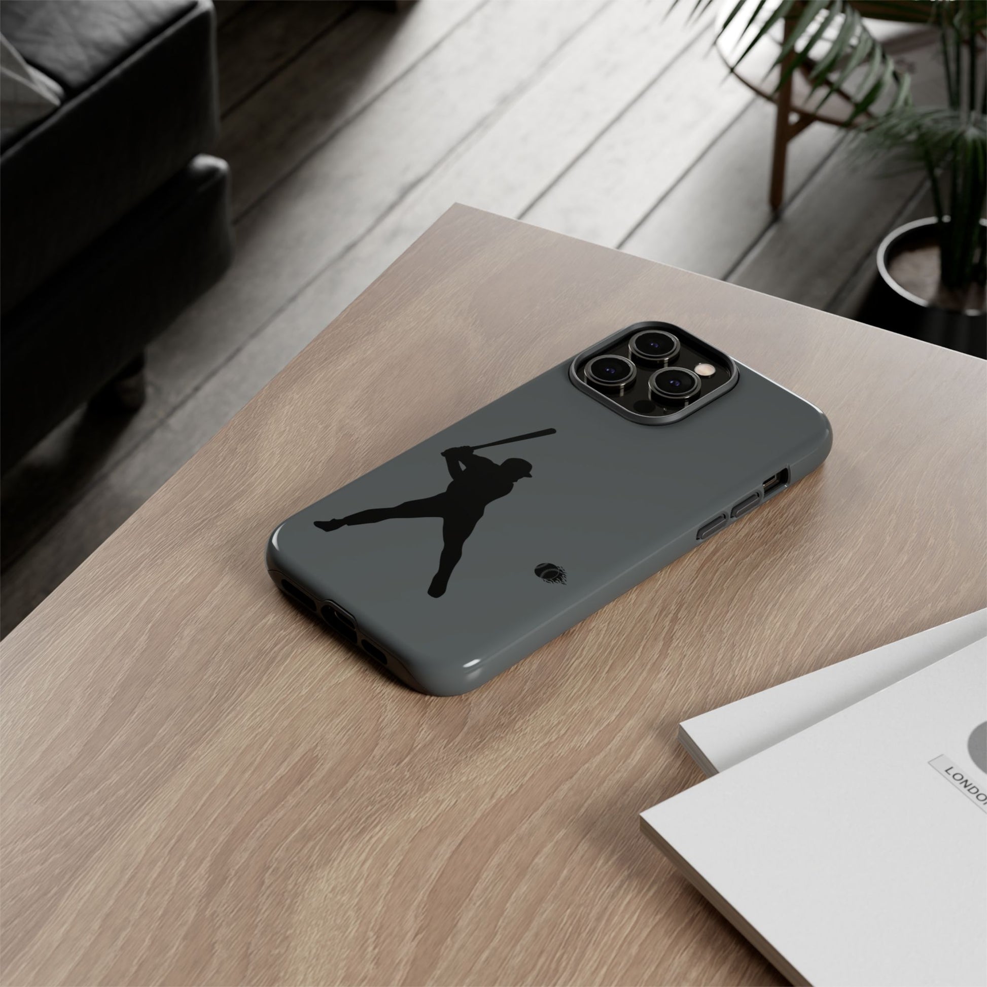 Black phone case with baseball silhouette design, protective sporty iPhone cover by Printify.