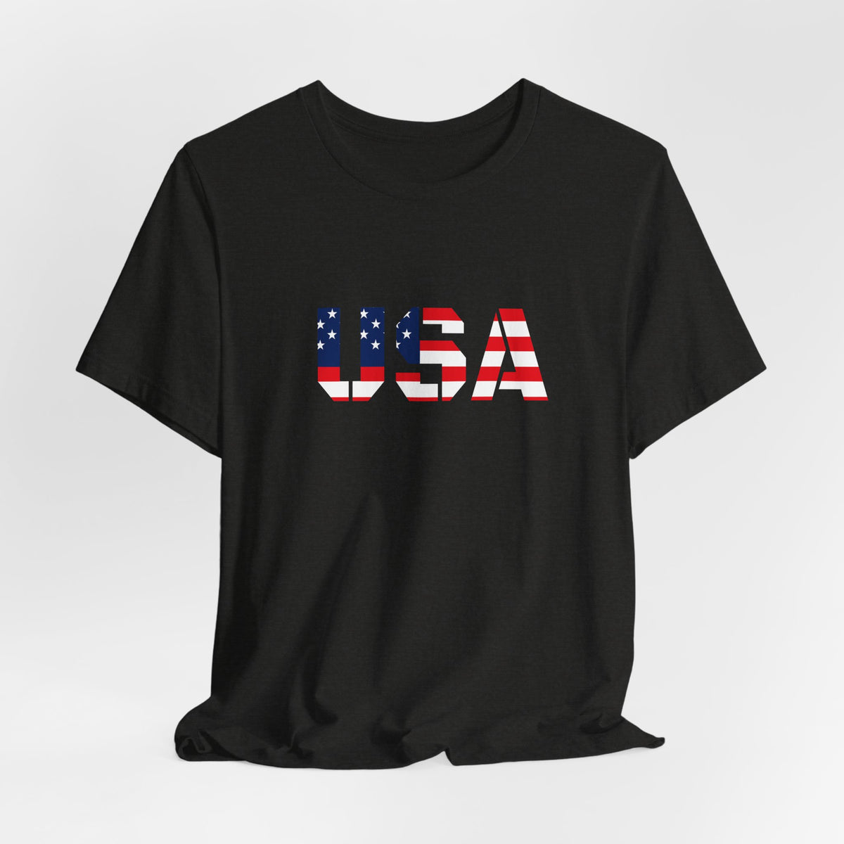 USA flag text T-shirt by Printify featuring patriotic Fourth of July design, with red, white, and blue colors and bold flag graphics.