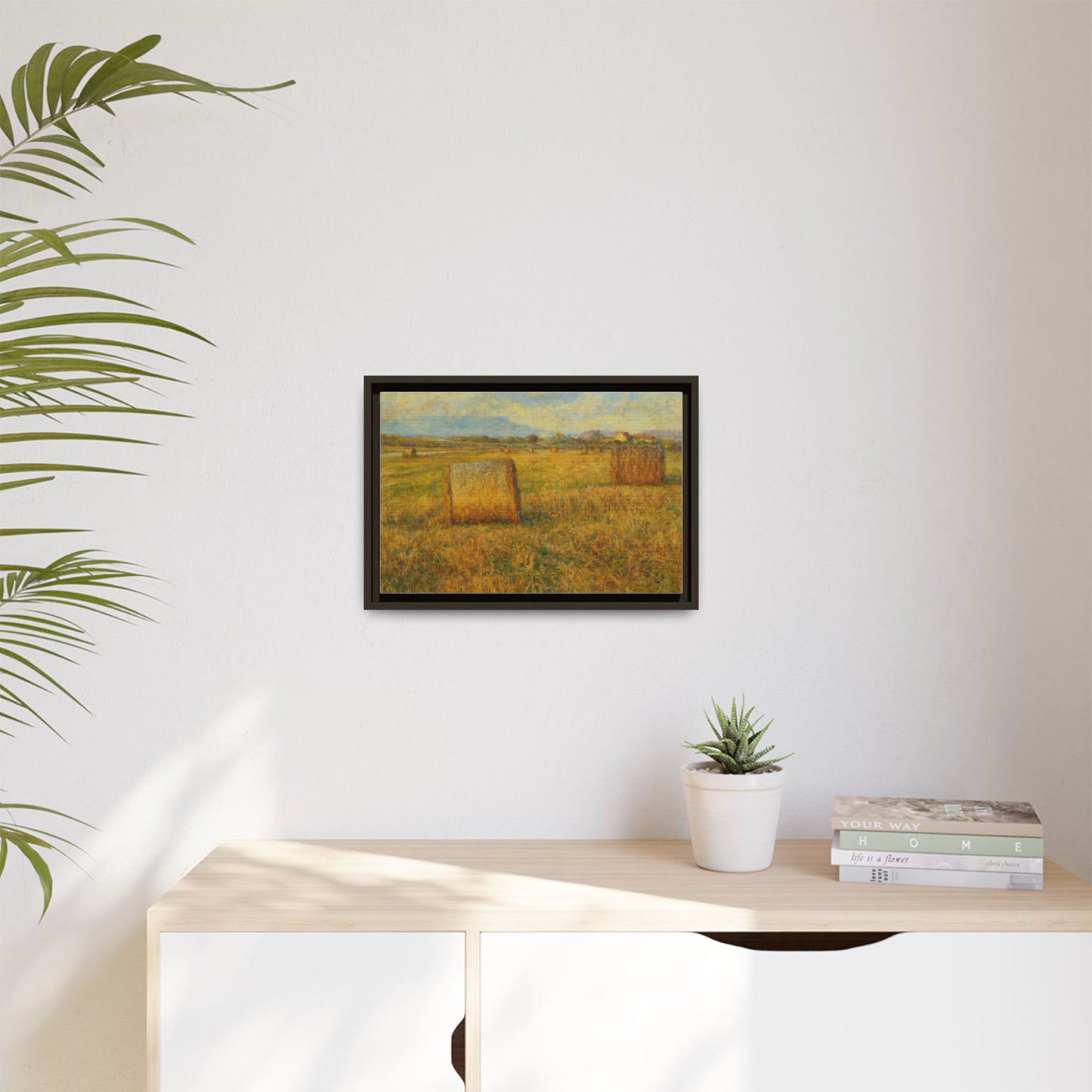 Framed matte canvas wall art featuring a rustic hayfield landscape print by Printify for home decor.