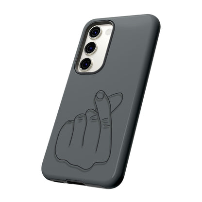 Silicone phone case with embossed Korean finger heart design, compatible with various smartphones, by Printify.