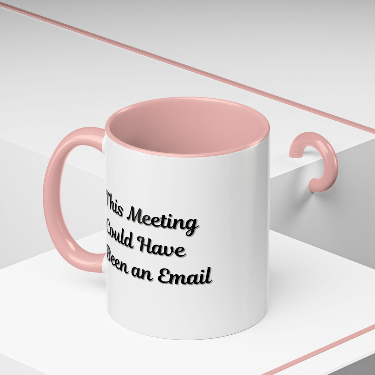 Funny office mug with the phrase "This Meeting Could Have Been An Email" printed in black on a white ceramic mug.