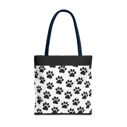 Eco-friendly paw print tote bag by Printify featuring black paw prints on natural canvas, perfect for dog and cat lovers.