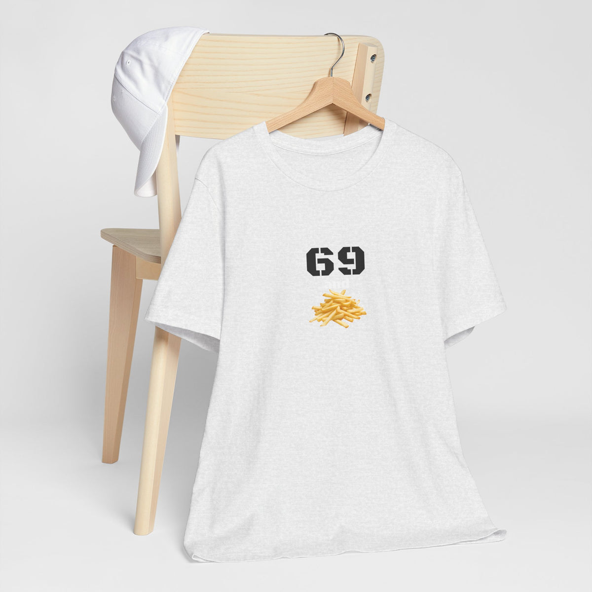 Unisex graphic T-shirt featuring humorous 69 and French fries design, in casual style, by Printify.